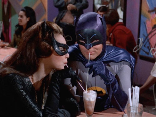 Batman and Catwoman in soda shop